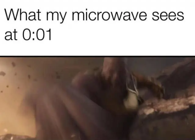 A relatable classic meme featuring a blurry, chaotic still of Thanos from Avengers: Infinity War. The text "What my microwave sees at 0:01" perfectly captures the high-stakes panic of stopping the timer just before the loud "beep" wakes up the entire house.