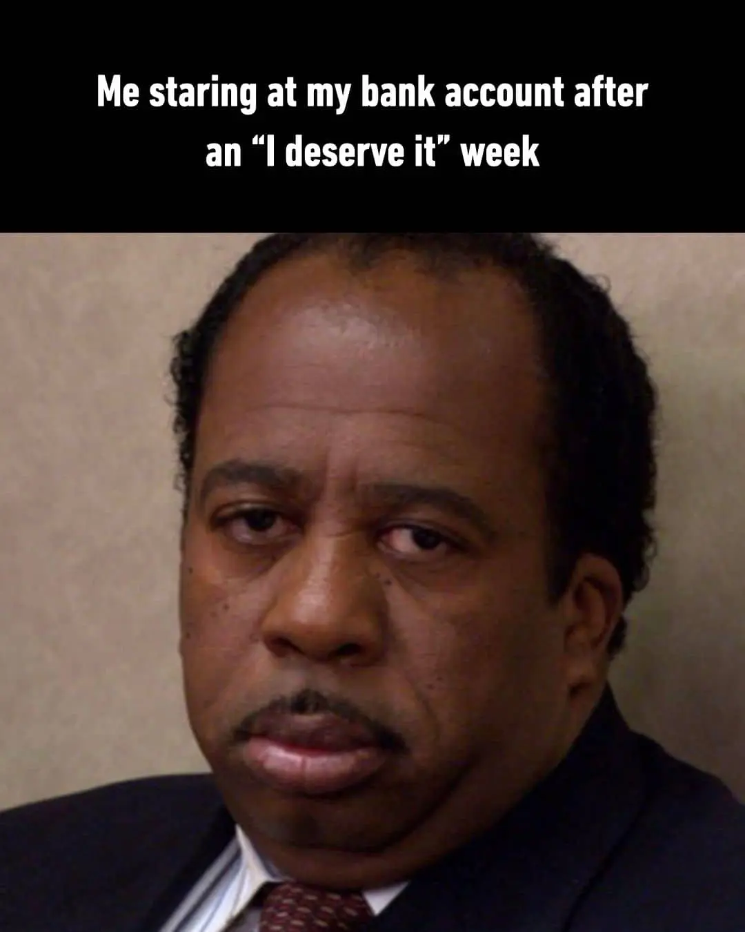 Character Stanley Hudson from The Office looking exhausted, representing staring at a low bank account balance.