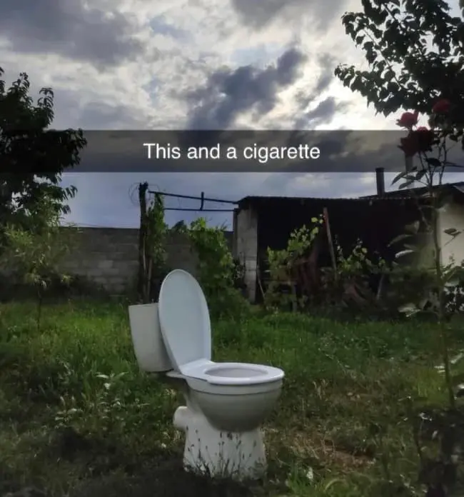 meme dump entry showing a lone white toilet sitting in an overgrown, grassy field under a dramatic, cloudy sky. A Snapchat-style text bar across the middle reads, "This and a cigarette," capturing a specific brand of surreal, low-budget relaxation.