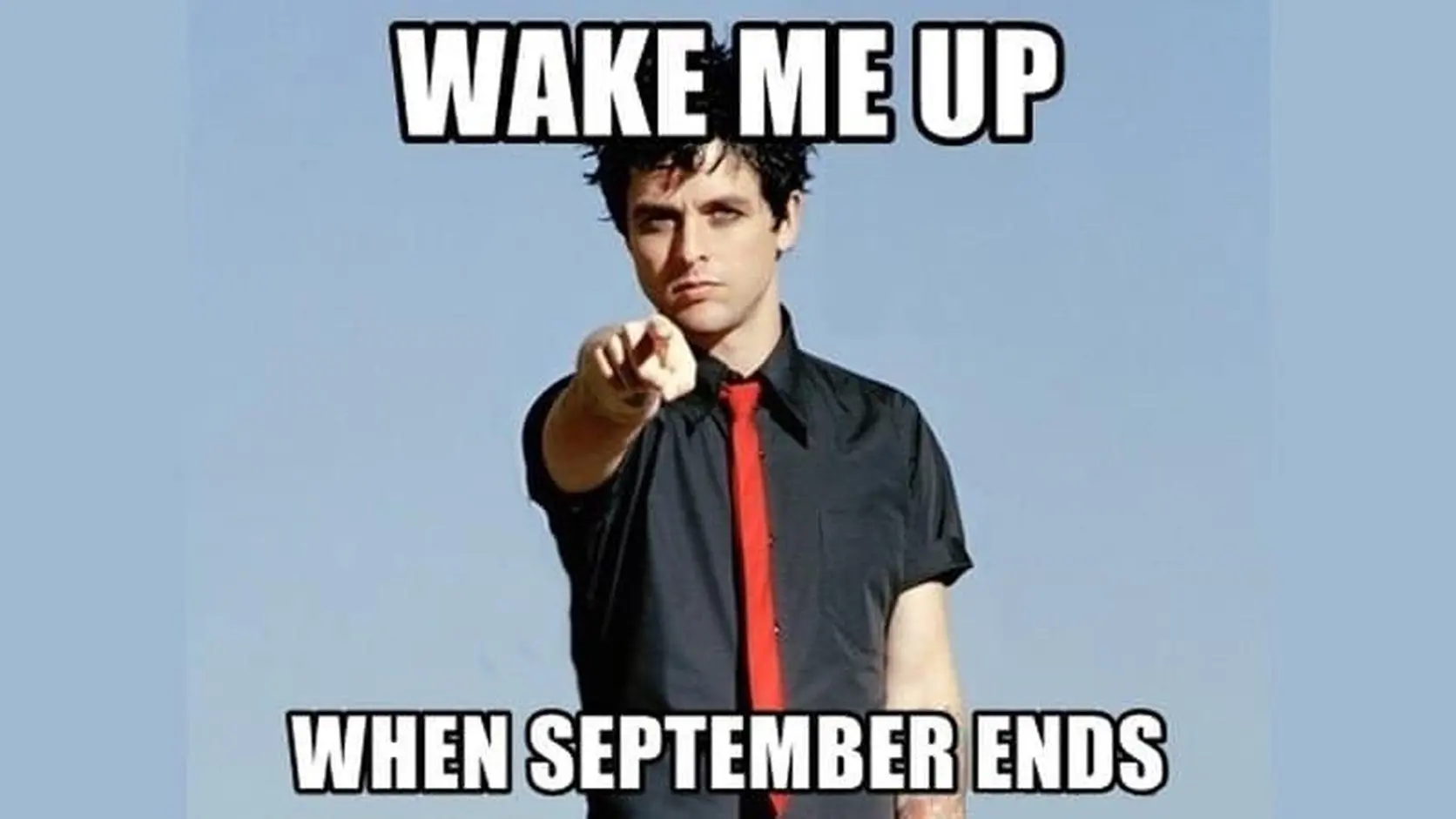 Billie Joe Armstrong in a black shirt and red tie points at the camera under the classic caption from Wake Me Up When September Ends memes.