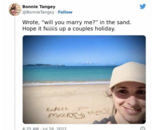 Wrote, "will you marry me?" in the sand. Hope it fu is up a couples holiday.