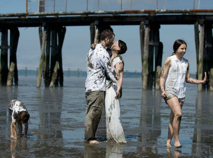 Awkward family photos beach covered in mud