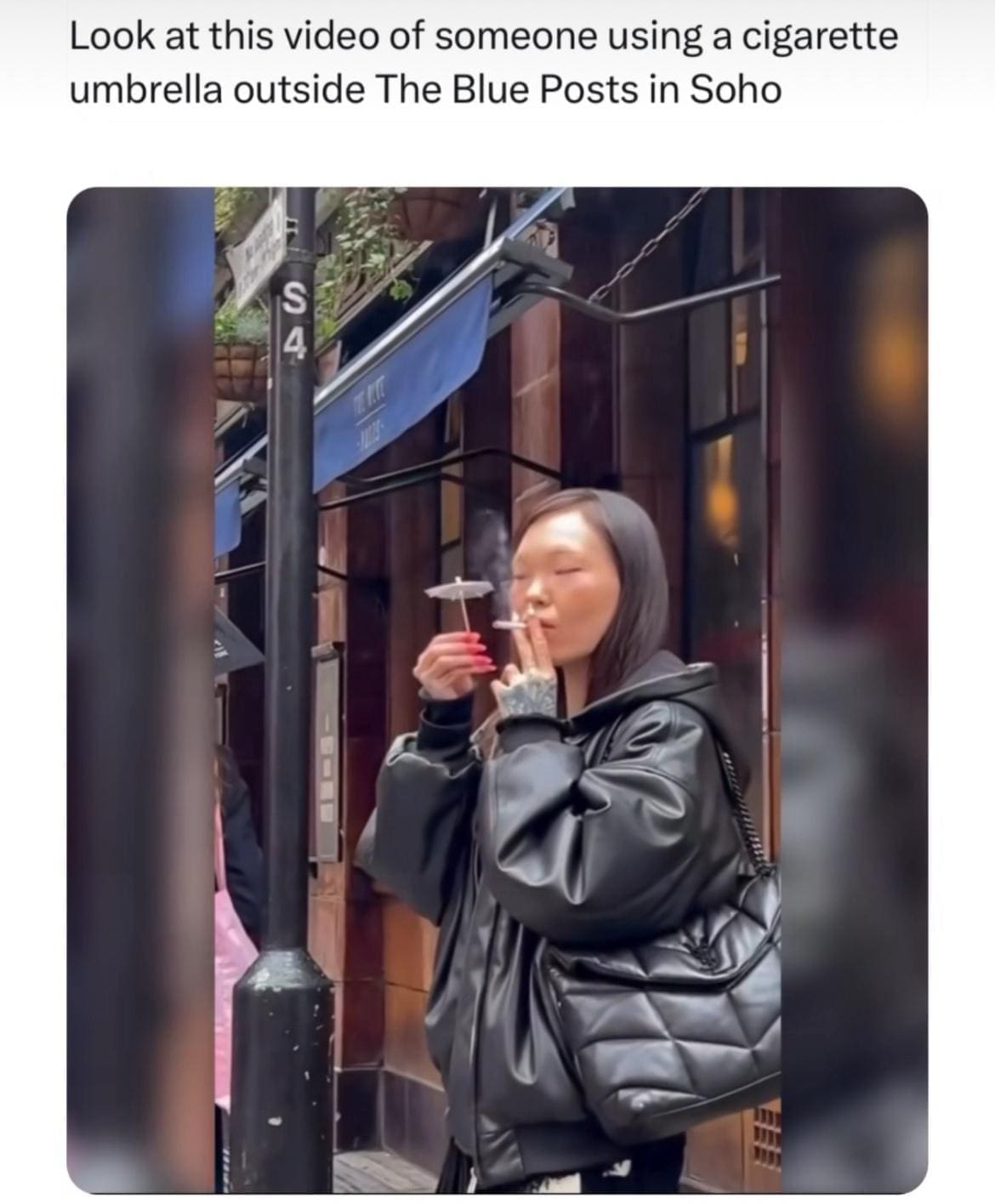 British Memes Look at this video of someone using a cigarette umbrella outside The Blue Posts in Soho