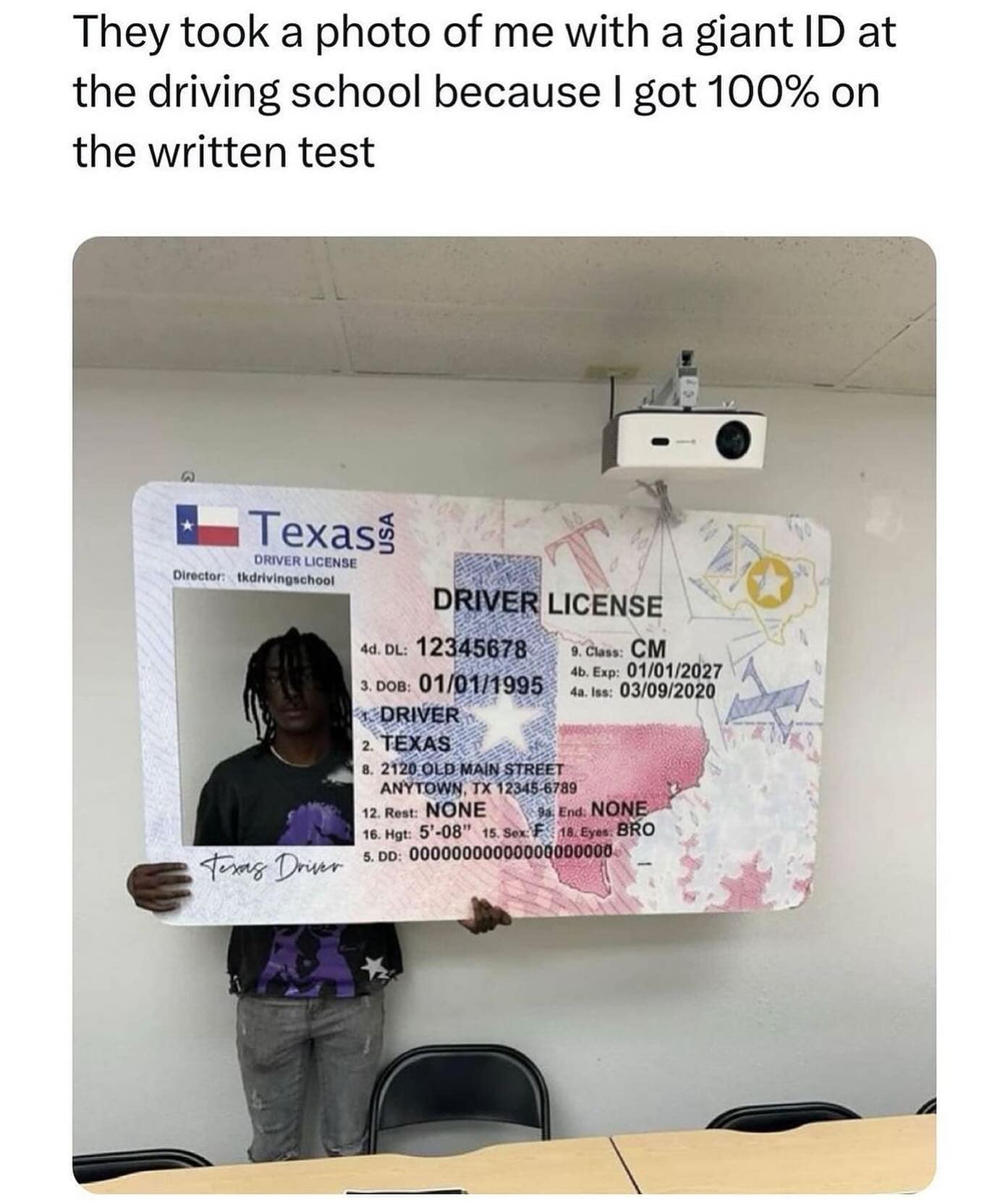 They took a photo of me with a giant ID at the driving school because I got 100% on the written test