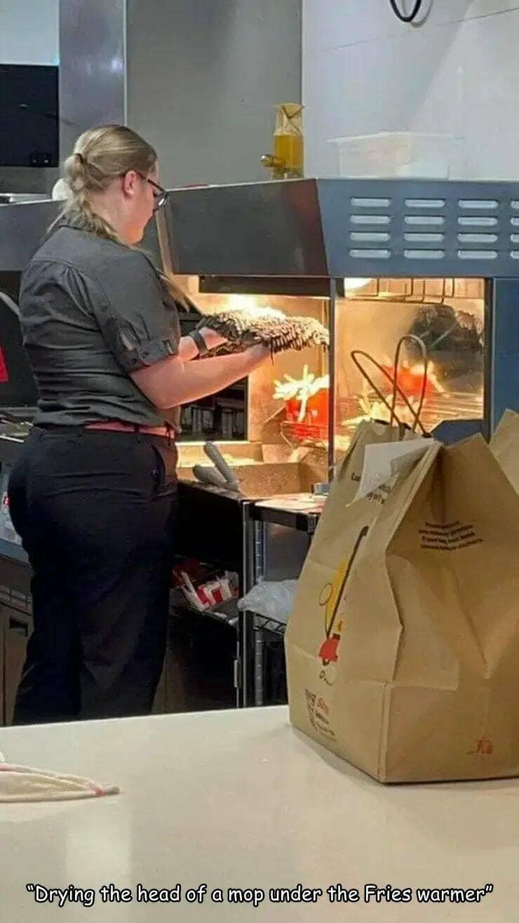 funny pics. "Drying the head of a mop under the Fries warmer"