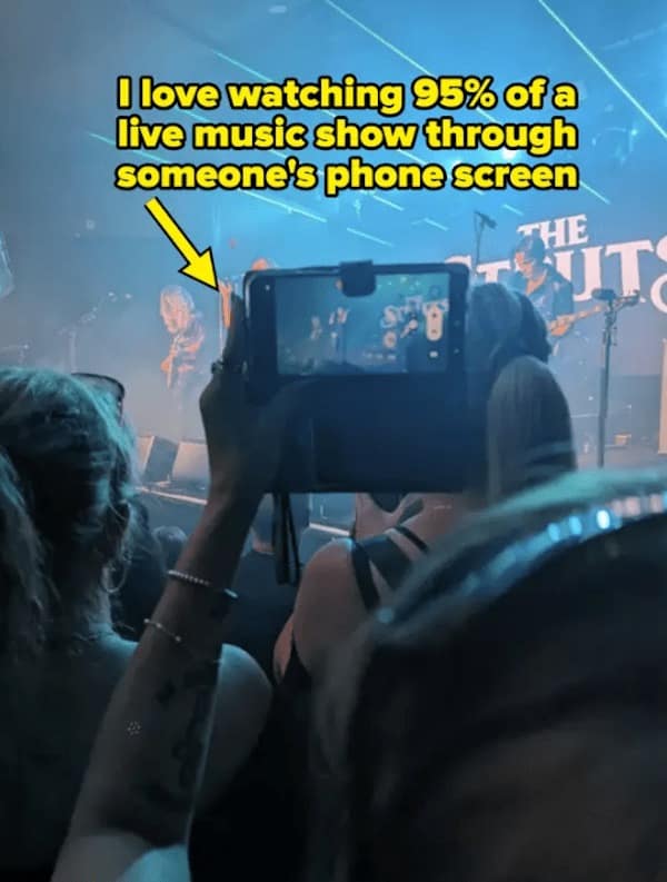 I love watching 95% of a live music show through someone's phone screen