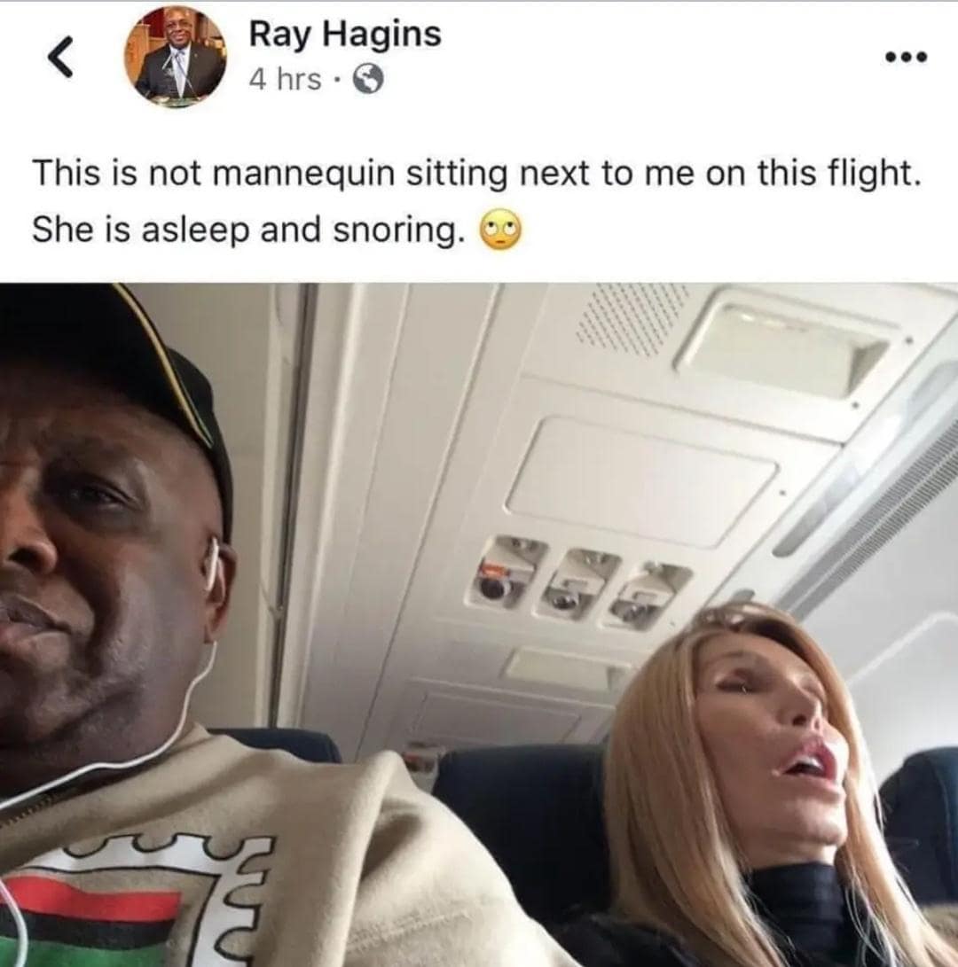 This is not mannequin sitting next to me on this flight. She is asleep and snoring.