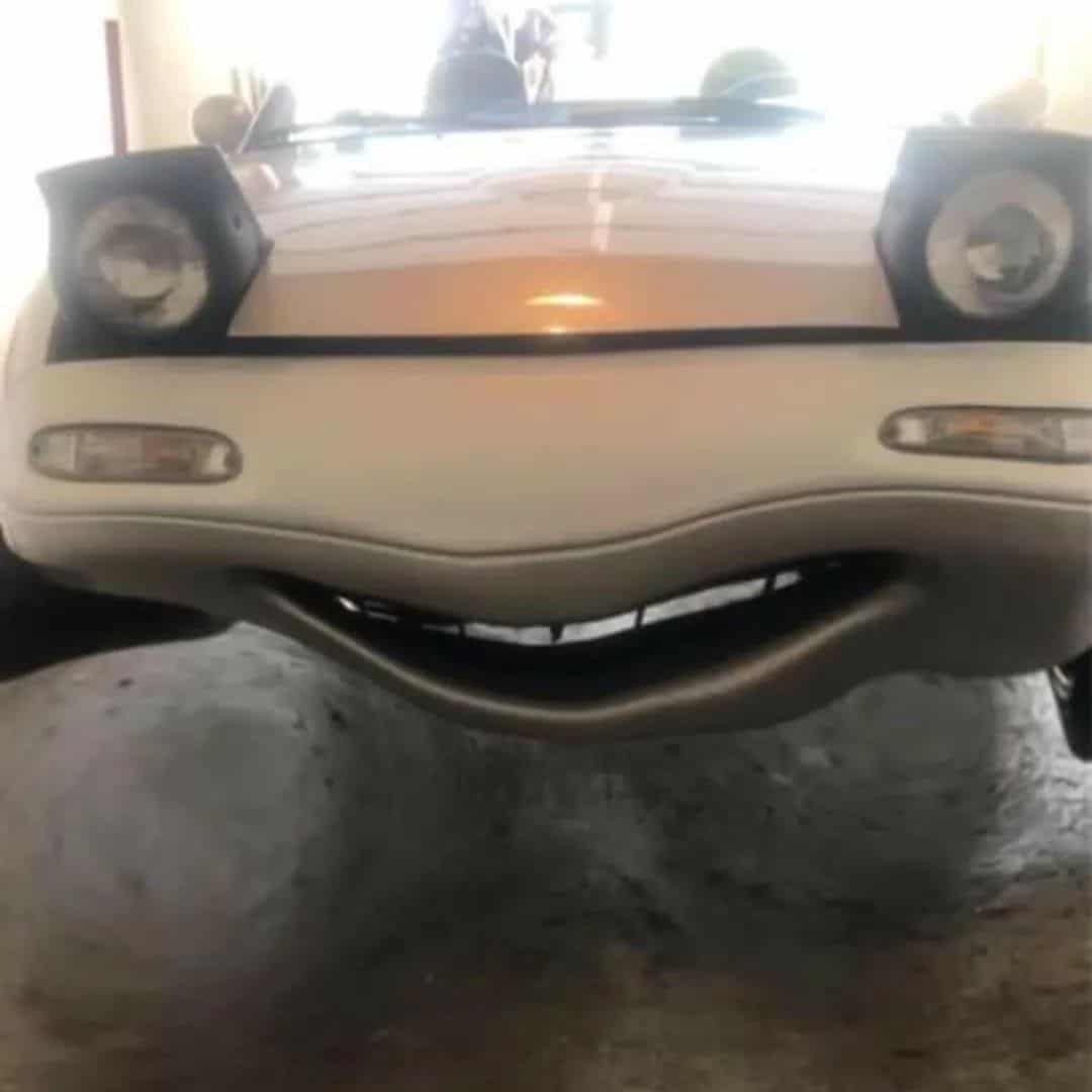 funny miata, miatas with threatening auras, comedic roadster bits, small convertible jokes, quirky sports car humor, Miata memes, comedic two-seater illusions, beloved tiny ride references, Mazda jokes, brand-based comedic angles, automaker witty bits, car humor, vehicular comedic lines, automotive meltdown commentary