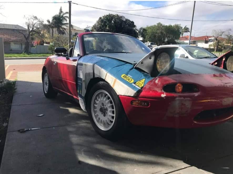 funny miata, miatas with threatening auras, comedic roadster bits, small convertible jokes, quirky sports car humor, Miata memes, comedic two-seater illusions, beloved tiny ride references, Mazda jokes, brand-based comedic angles, automaker witty bits, car humor, vehicular comedic lines, automotive meltdown commentary