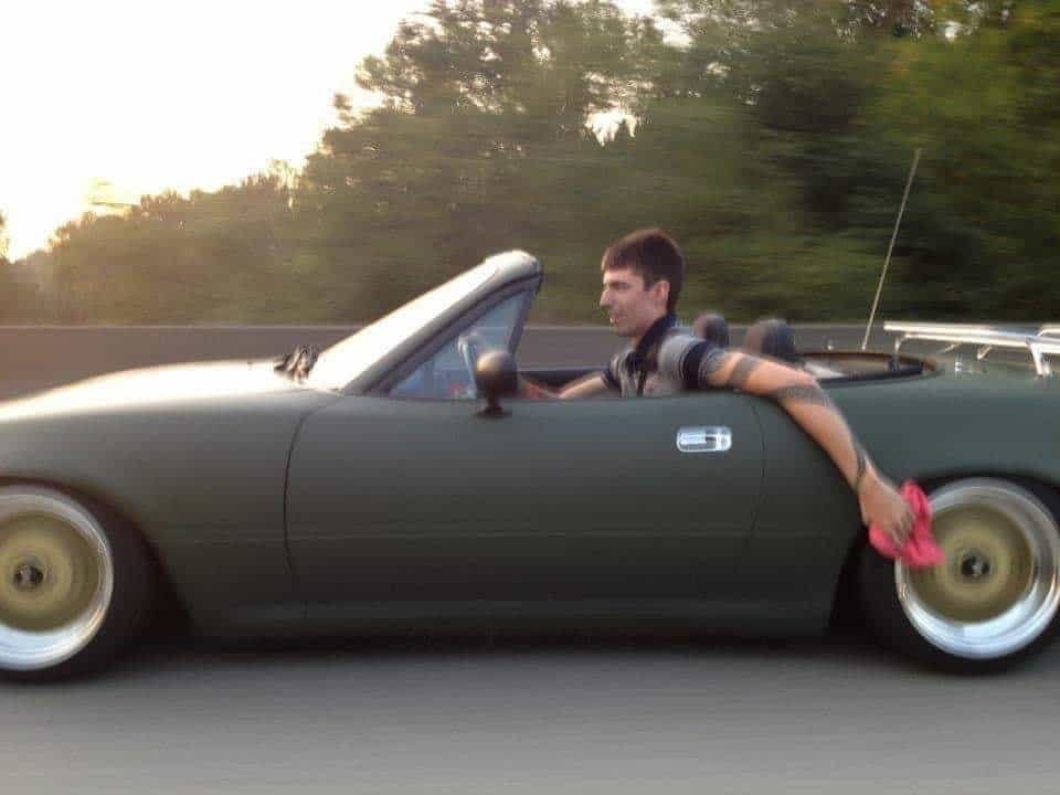 funny miata, miatas with threatening auras, comedic roadster bits, small convertible jokes, quirky sports car humor, Miata memes, comedic two-seater illusions, beloved tiny ride references, Mazda jokes, brand-based comedic angles, automaker witty bits, car humor, vehicular comedic lines, automotive meltdown commentary