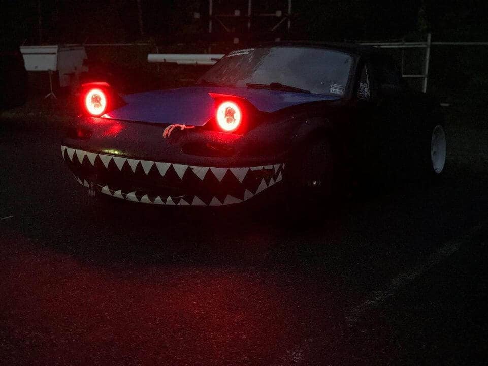 funny miata, miatas with threatening auras, comedic roadster bits, small convertible jokes, quirky sports car humor, Miata memes, comedic two-seater illusions, beloved tiny ride references, Mazda jokes, brand-based comedic angles, automaker witty bits, car humor, vehicular comedic lines, automotive meltdown commentary