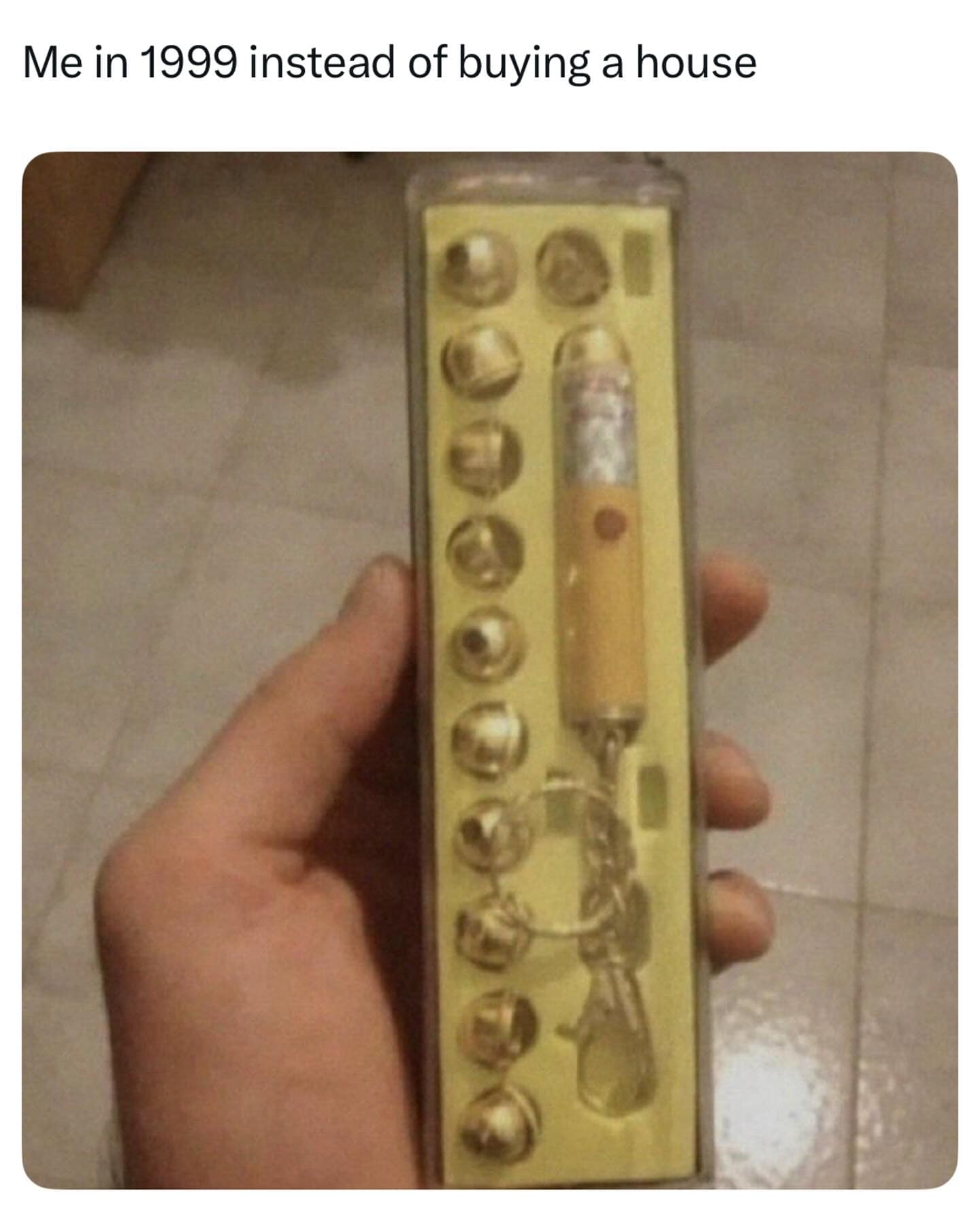 Close-up of a retro keychain laser pointer set with multiple attachments.