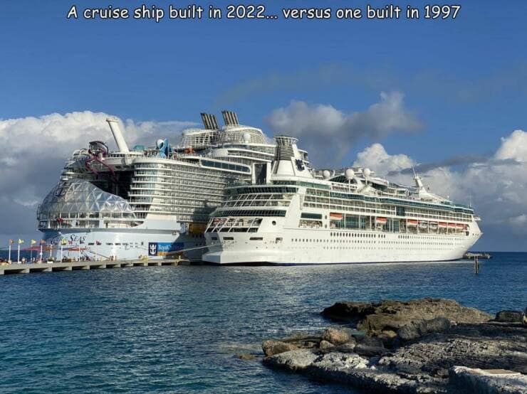 A massive 2022 cruise ship compared to a smaller 1997 cruise ship side by side.