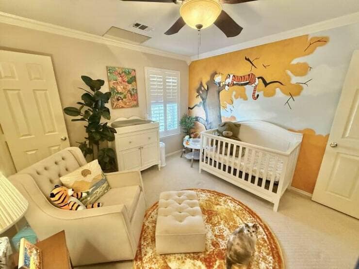Amazing home decor pictures: nursery with hand-painted Calvin and Hobbes mural, crib and armchair