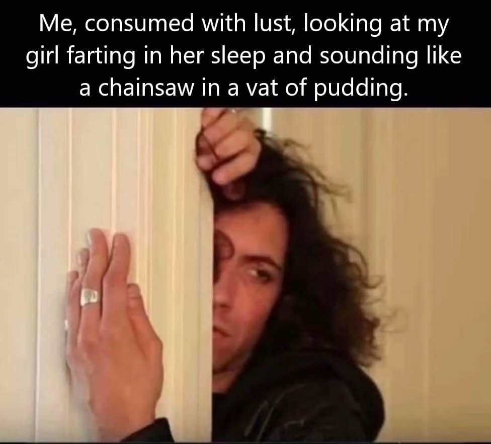 a man peeking around a door, caption about hearing his girlfriend fart in her sleep.