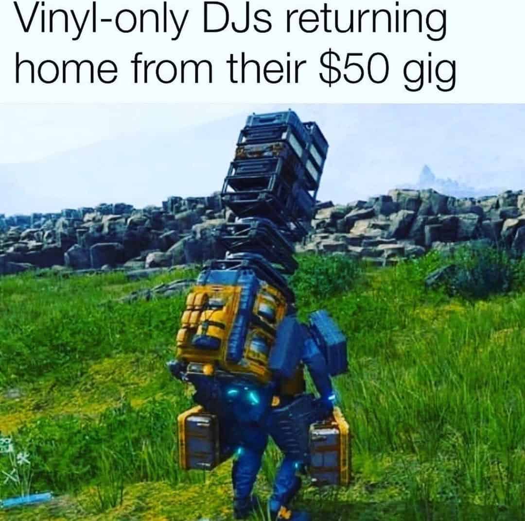 Video game character overloaded with crates labeled as vinyl DJ gear.