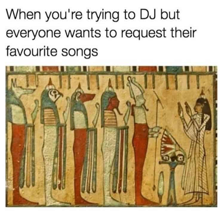 Egyptian wall art with DJ trying to avoid song requests.
