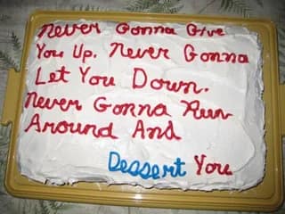 A funny cake that is also a perfect Rickroll meme with a clever "dessert" pun.