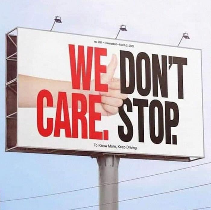 A confusingly designed billboard that reads "WE DON'T CARE. STOP." due to poor typography.