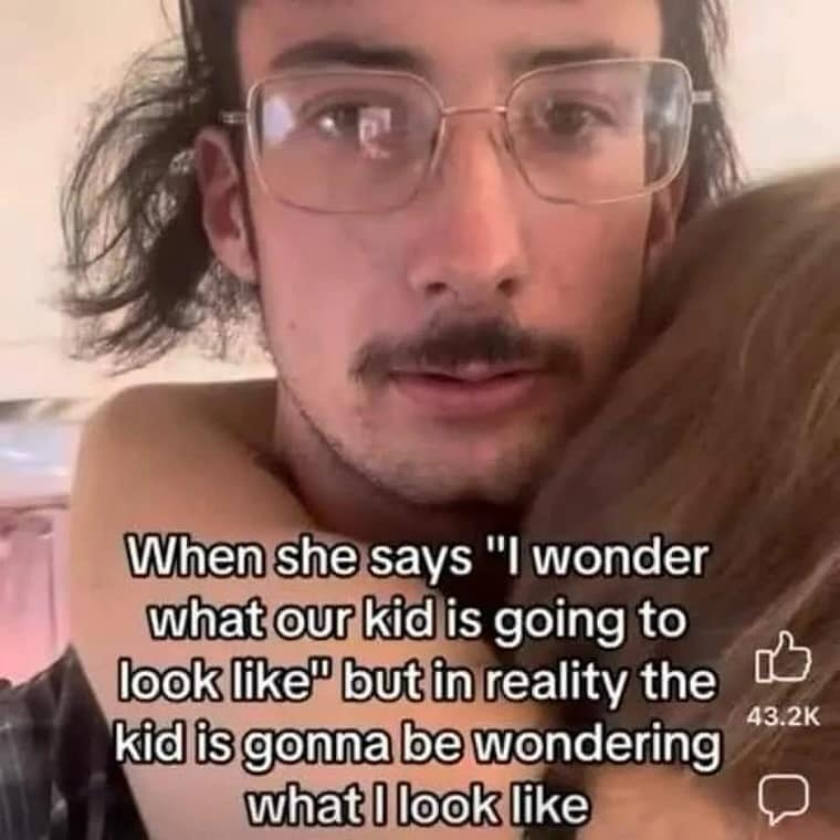 Man with confused stare hugging a woman