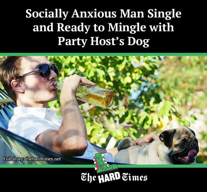 Man at party drinking beer while bonding with host’s dog