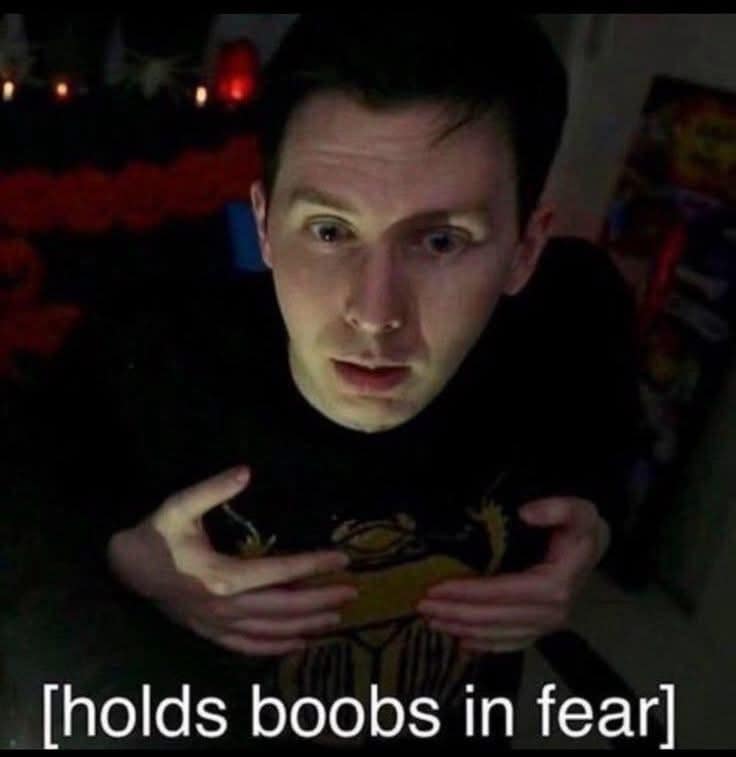 A funny pic of a reaction image with the caption "[holds boobs in fear]."
