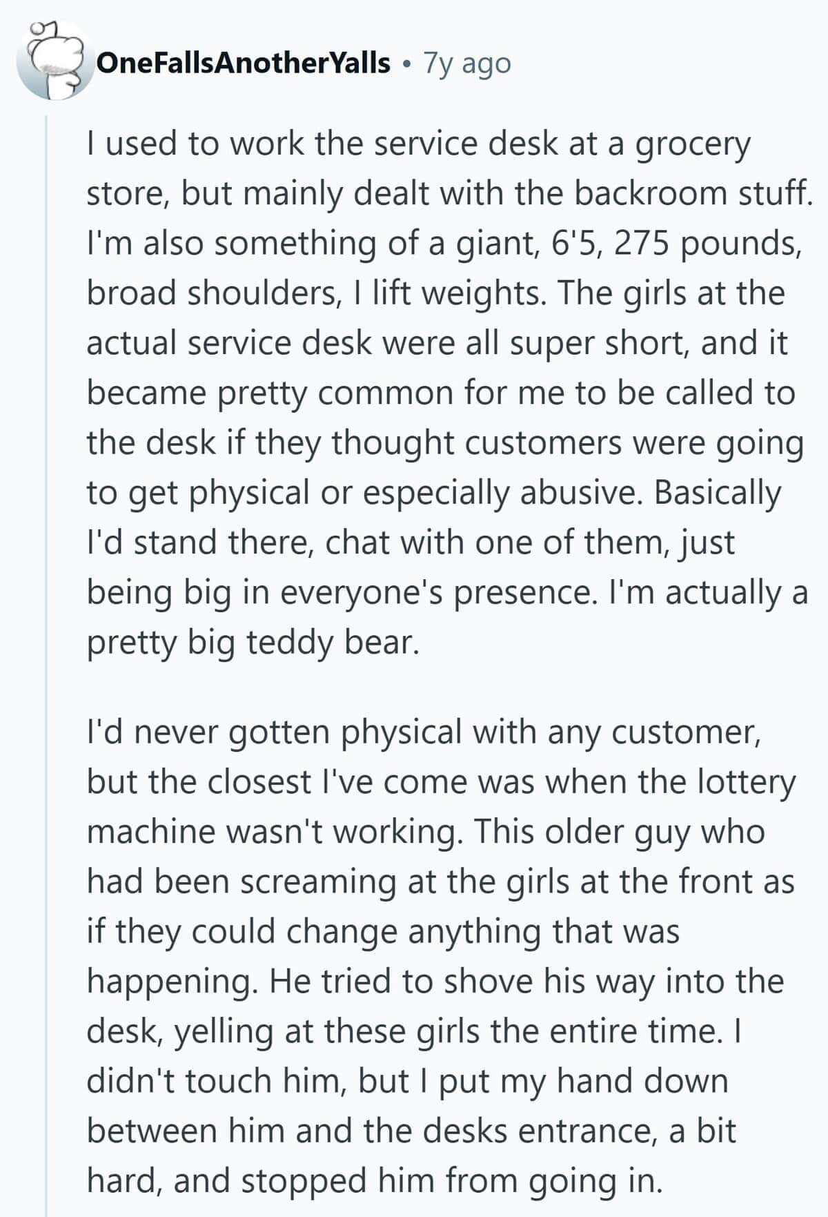 A large grocery store employee is used as a physical deterrent for abusive customers at the service desk.