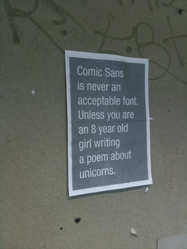 Printed sign declaring Comic Sans unacceptable unless an 8-year-old writes a unicorn poem.
