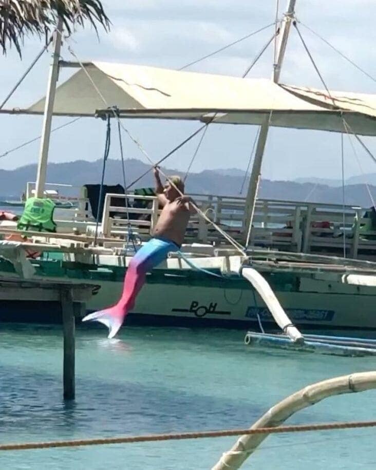 An influencer getting busted for struggling to get out of the water in a mermaid costume.