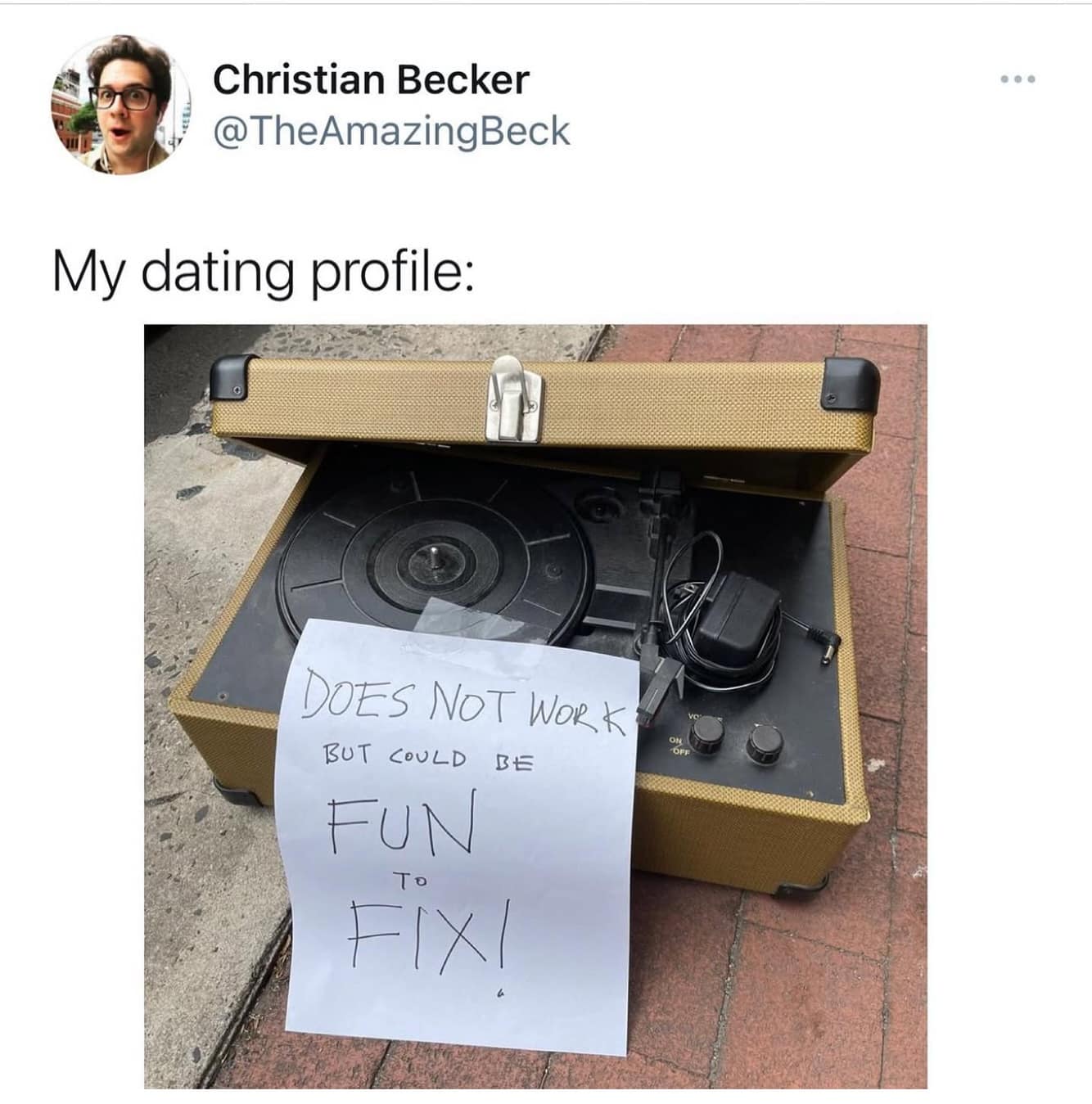 Broken record player with sign “DOES NOT WORK BUT COULD BE FUN TO FIX!”; caption “My dating profile.”