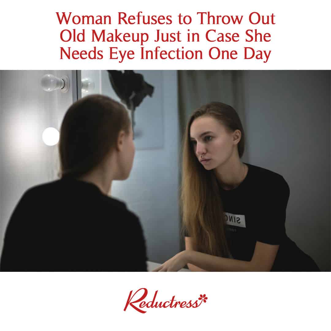 Woman staring at her reflection in a makeup mirror; headline reads, "Woman Refuses to Throw Out Old Makeup Just in Case She Needs Eye Infection One Day."