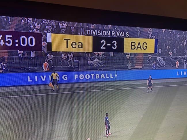 A hilarious video game score bug showing a soccer match between teams named "Tea" and "BAG".