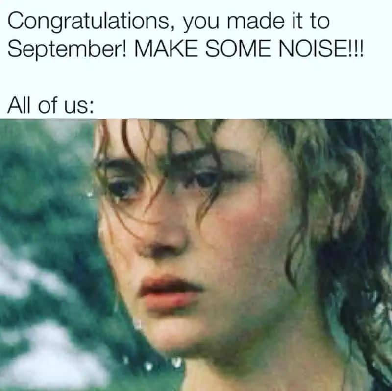 Close-up of a rain-soaked person looking tired; top text says “Congratulations, you made it to September! MAKE SOME NOISE!!! All of us:”.