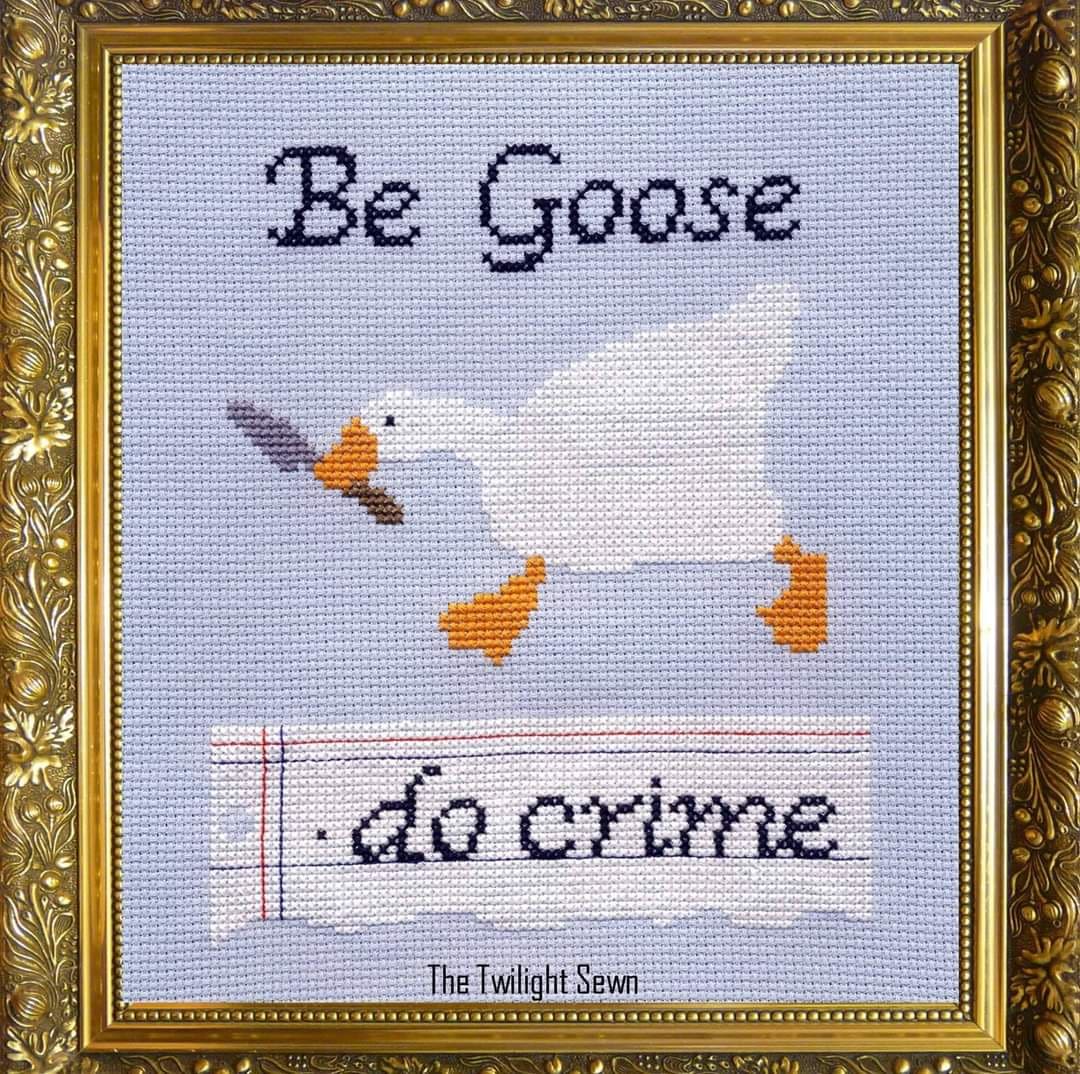 A funny and chaotic cross-stitch of the goose from the popular video game "Untitled Goose Game" with the phrase "Be Goose, do crime."