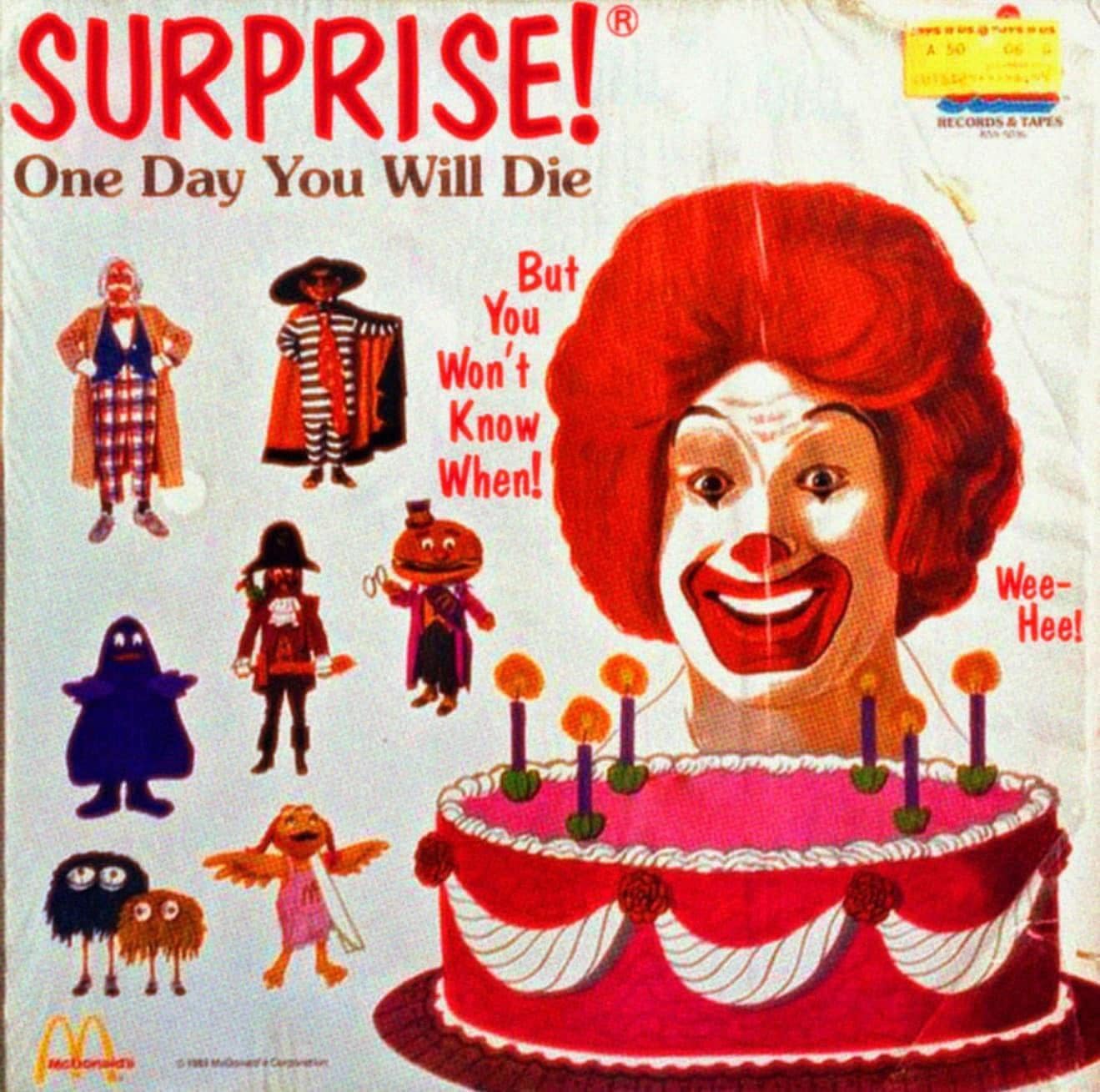 A bizarre and cursed, fake McDonald's record album cover from the 1980s that features a creepy-looking Ronald McDonald and says "SURPRISE! One Day You Will Die."