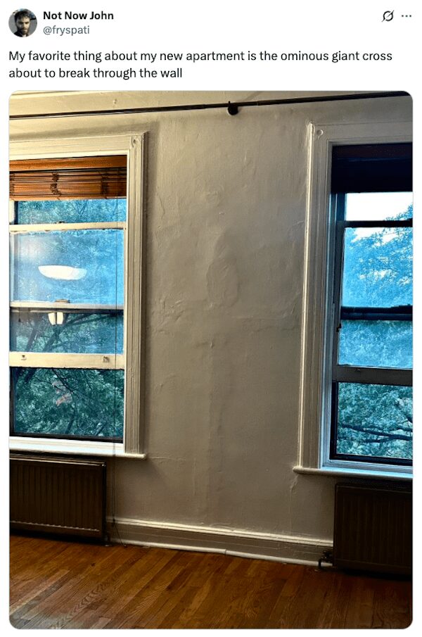 A funny landlord special where a giant, ominous cross has been poorly plastered and painted over on a wall.