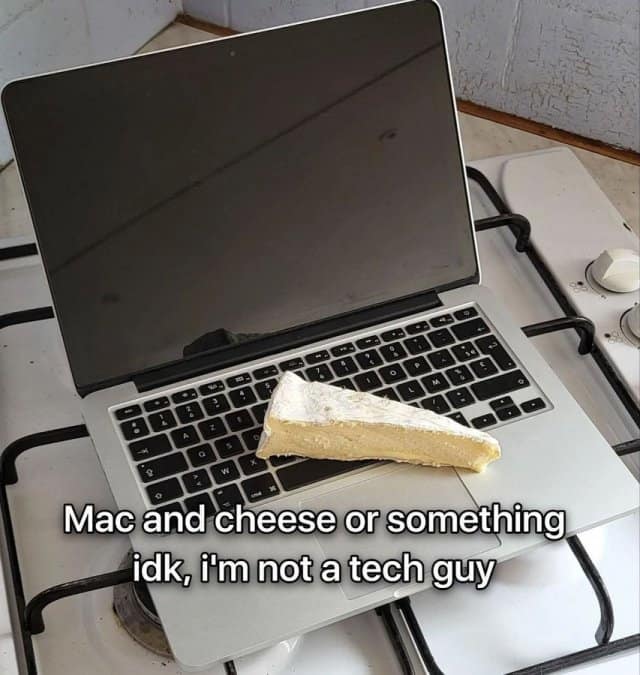 A funny meme dump pun showing a MacBook laptop with a wedge of cheese on it.