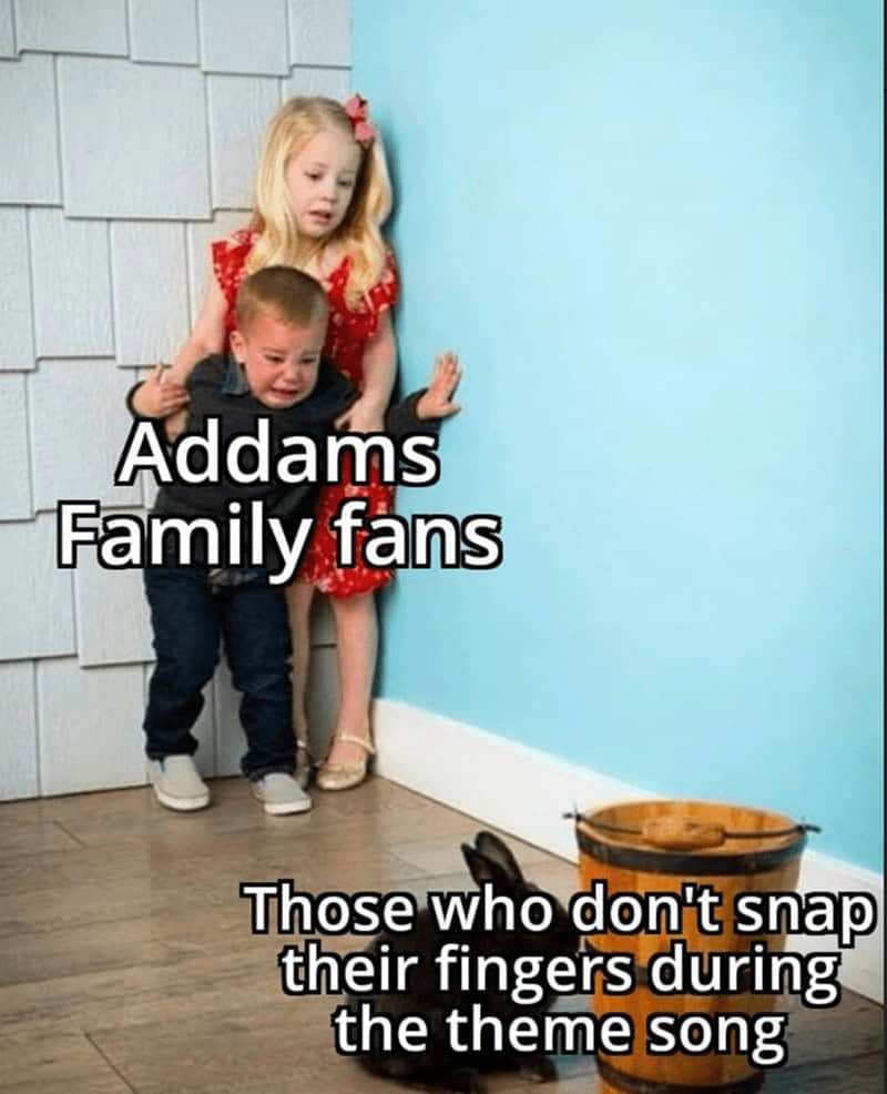 A funny meme showing "Addams Family fans" as scared children who are cowering in fear from people who don't snap their fingers during the theme song.
