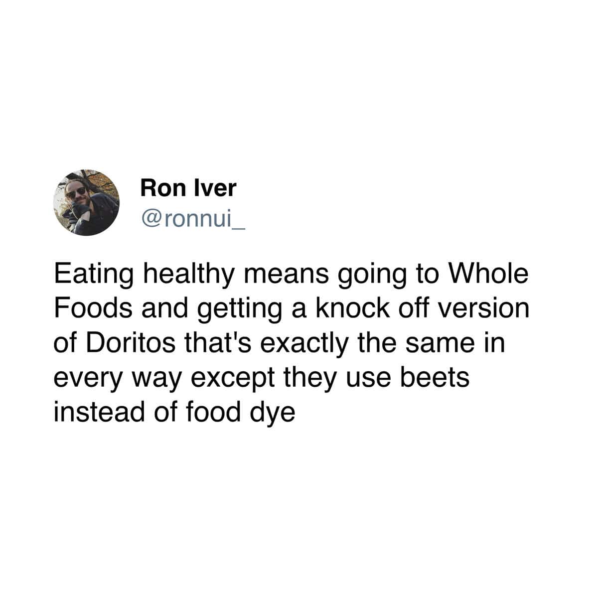 A funny and accurate tweet that perfectly defines the modern concept of "eating healthy" as just buying the Whole Foods version of Doritos that is made with beets.