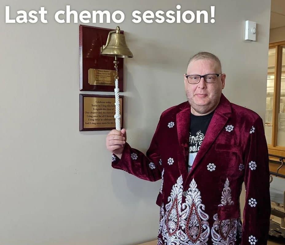 A wholesome meme of a man in a fancy jacket ringing the bell for his last chemo session.