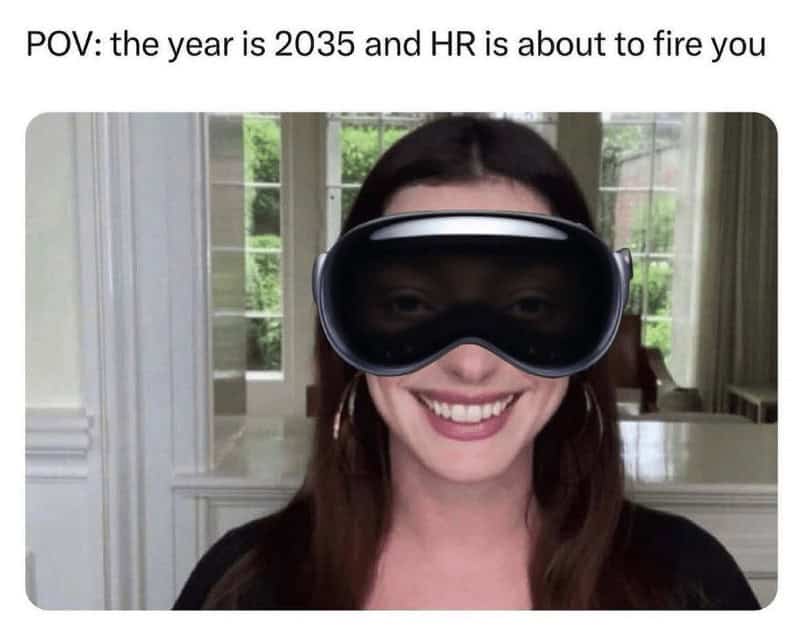 Smiling woman wearing a big mixed-reality headset on a video call; caption suggests HR is about to fire you in 2035.