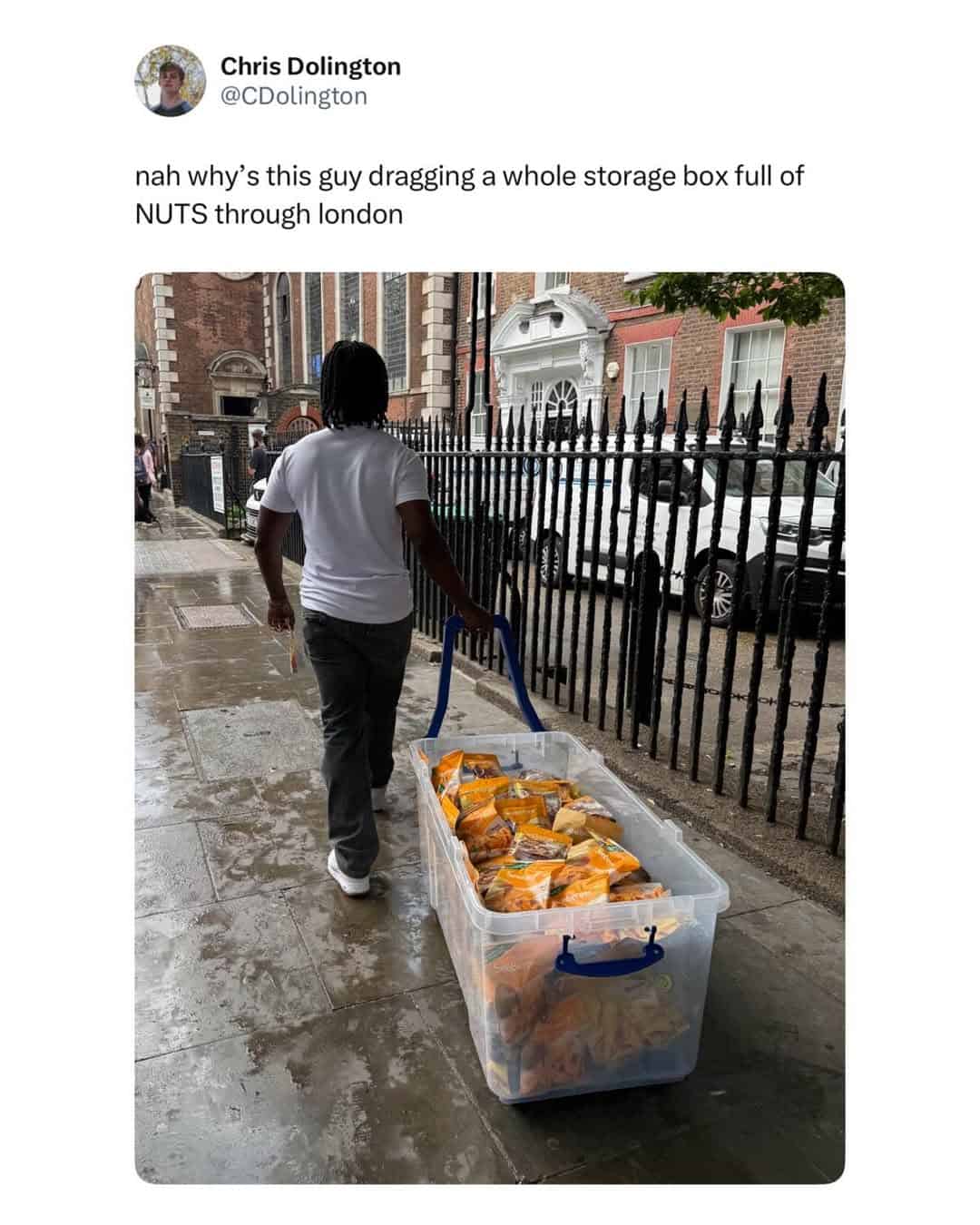 A funny British tweet showing a man in London dragging a giant storage container full of bags of nuts.