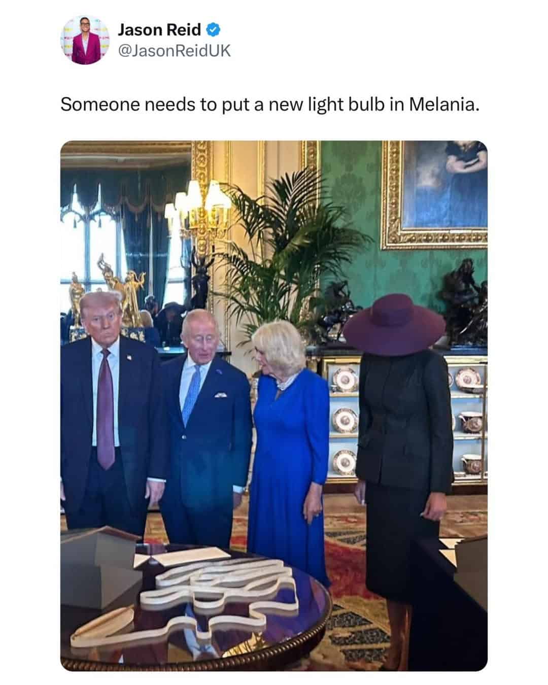 A funny British tweet making a joke about Melania Trump's large hat making her look like a lamp that needs a new bulb.