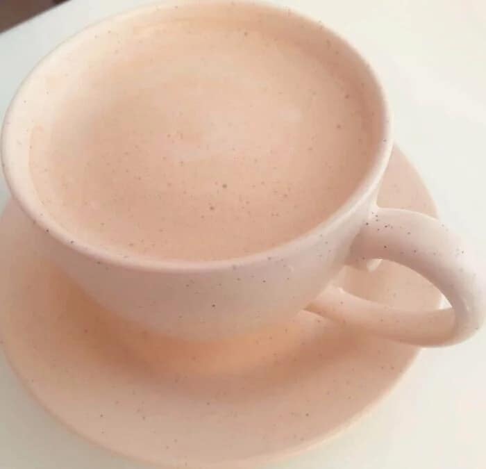 A subtle glitch in the matrix example showing pink coffee that achieves accidental camouflage with the pink mug.