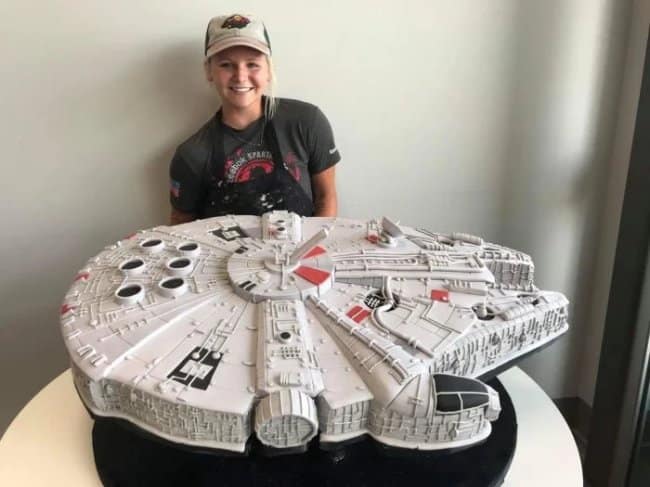 An amazing cake photo of a hyper-realistic Millennium Falcon cake from the movie Star Wars