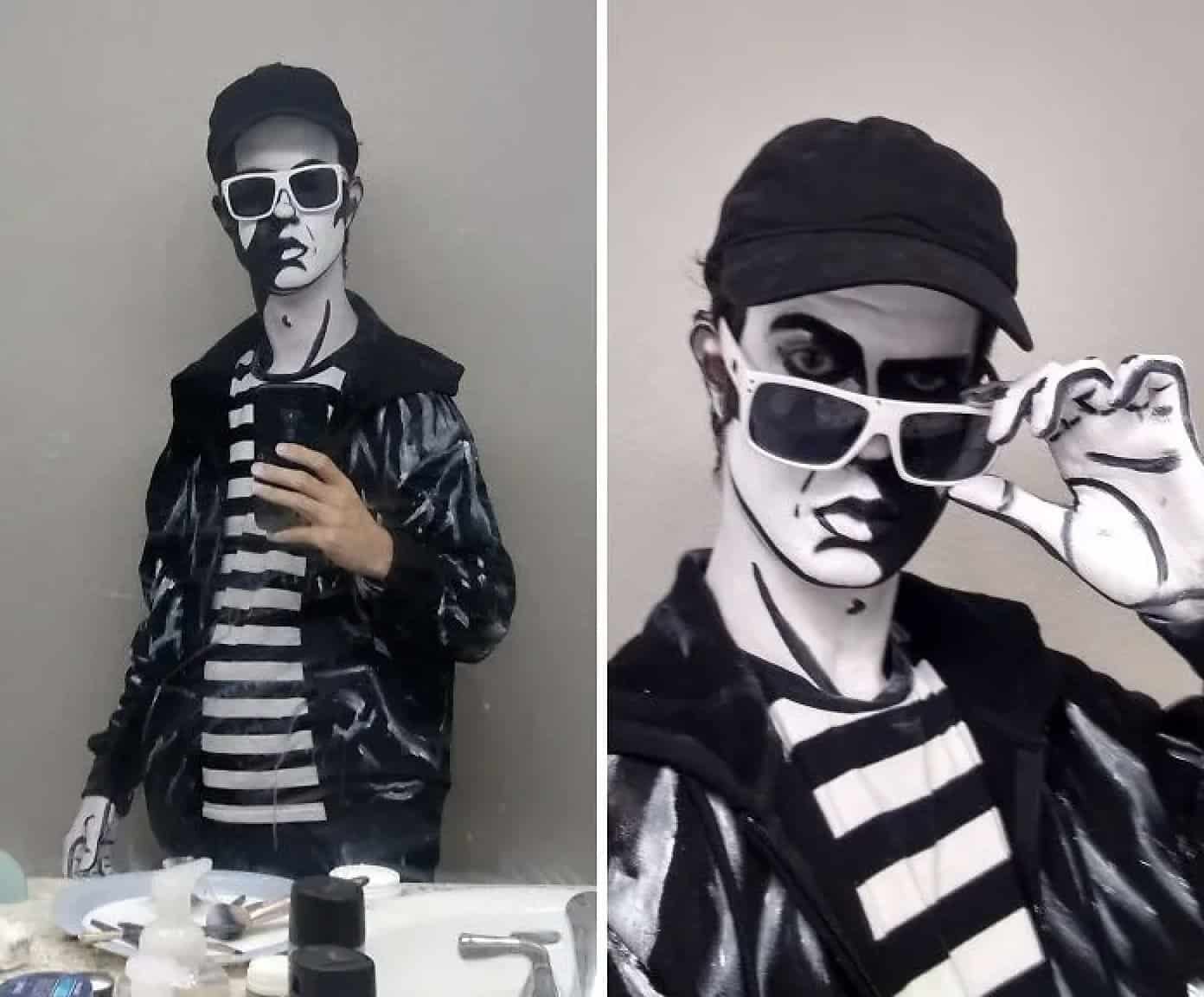 A person using black and white makeup to create a striking comic book or graphic novel character effect.