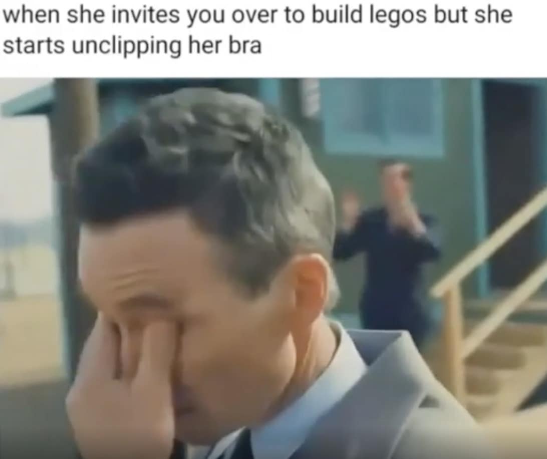 A funny meme of Tom Hanks from Saving Private Ryan crying about building Legos.