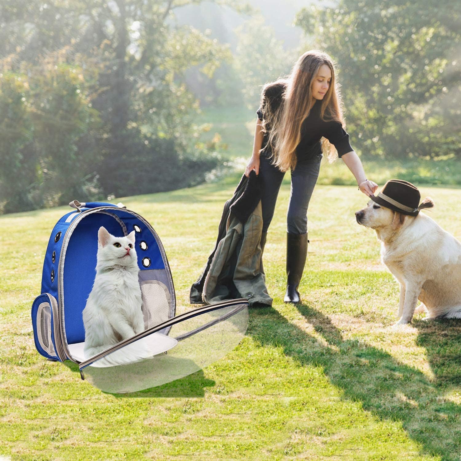 Chaotic funny photoshop fail combining a woman, a dog in a hat, and a cat in a backpack carrier poorly