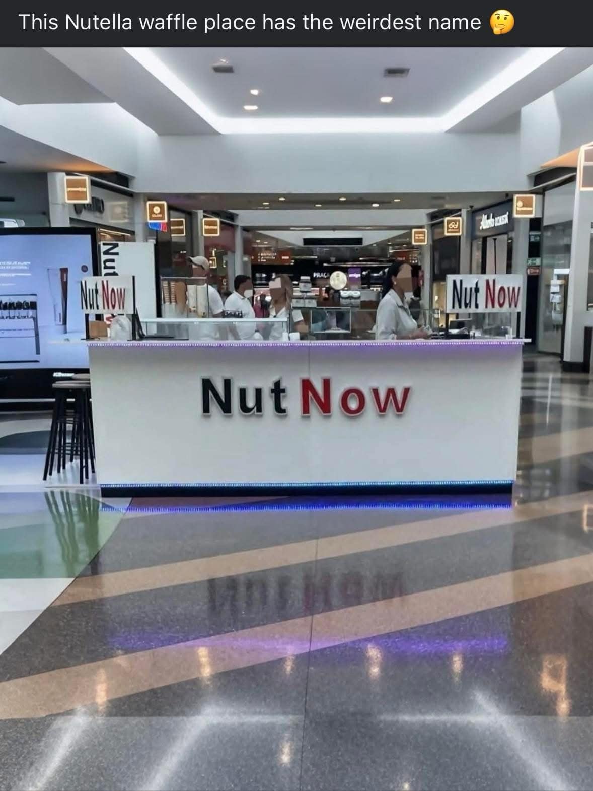 : A funny photo of a mall food court kiosk with the very unfortunate name "Nut Now."