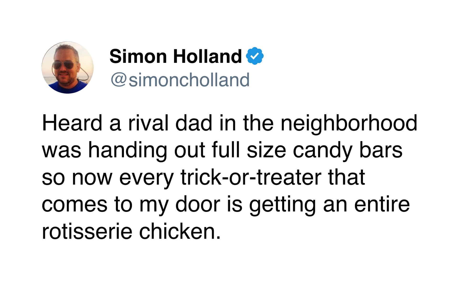 Funny Halloween tweet about a dad one-upping neighbors giving out full-size candy bars by giving rotisserie chickens.